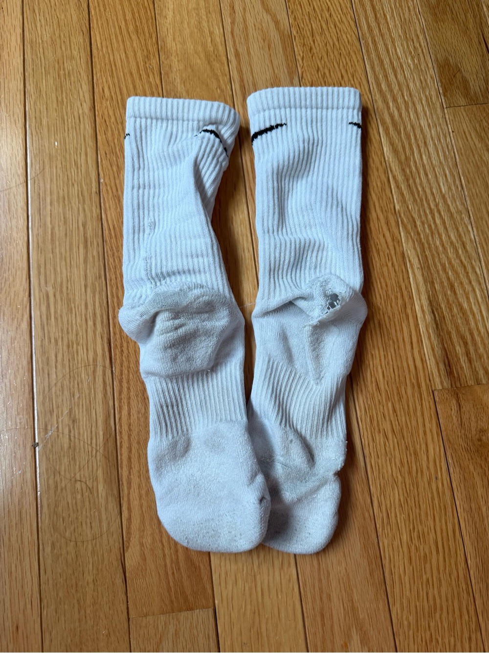 very worn nike crew socks with holes